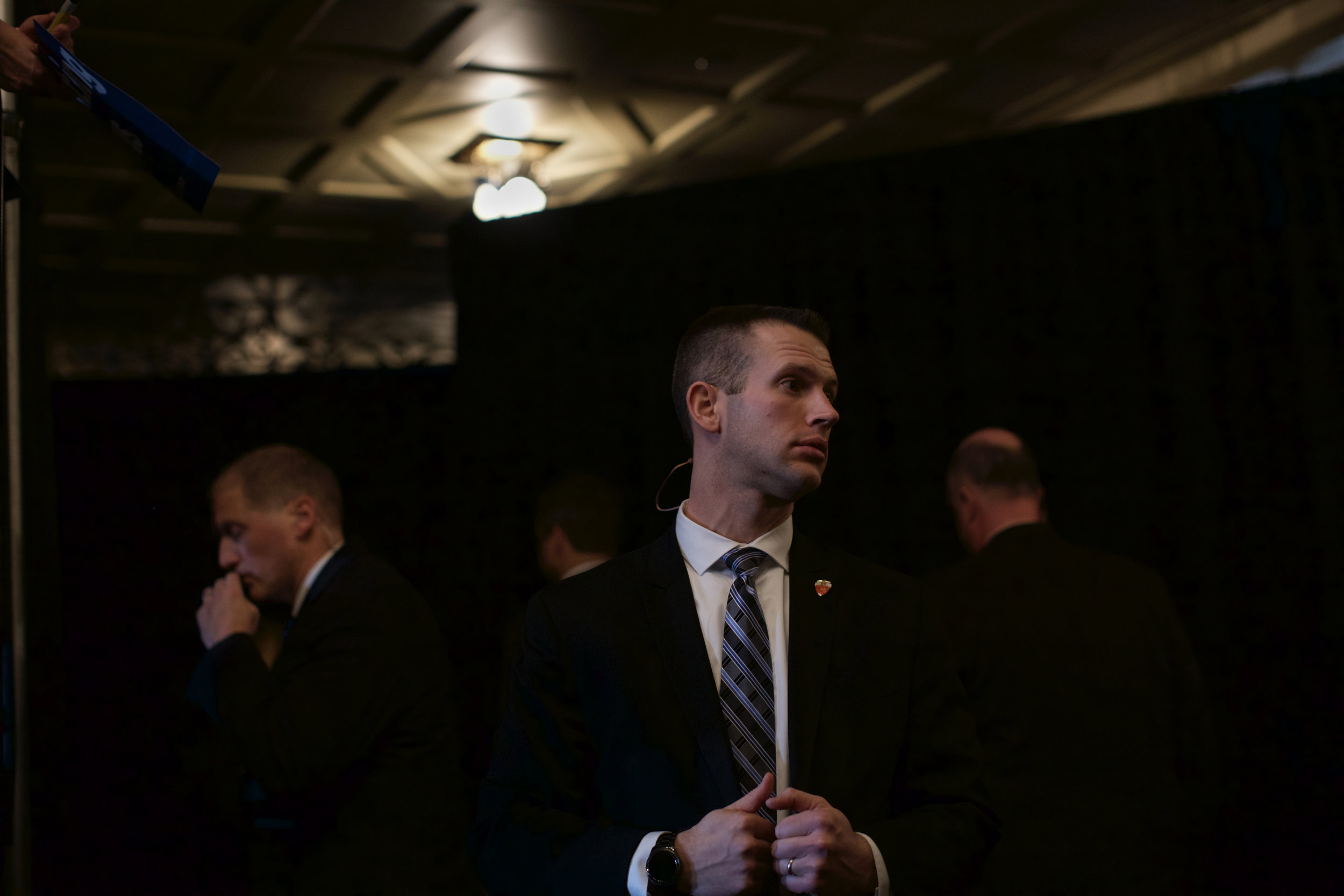 A member of the Secret Service monitors the crowd while Hillary Clinton signs posters and takes photos with attendants of the political rally on Thursday, Jan. 21, 2016 in the IMU. The former Secretary of State was introduced by pop singer Demi Lovato. (The Daily Iowan/Brooklynn Kascel)