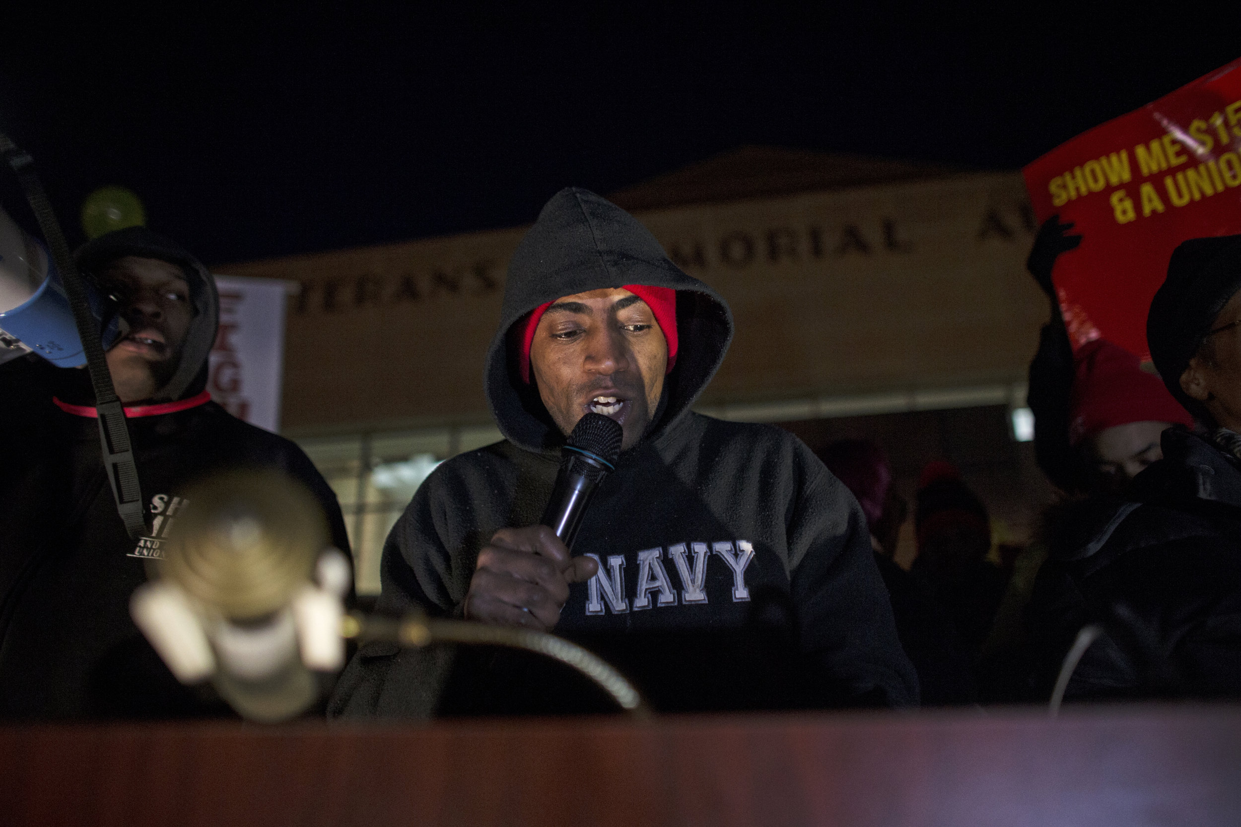 Terrance Wise speaks to a crowd of protesters before the Republican Debate outside the Iowa Events Center in Des Moines on Thursday, Jan. 28, 2016. A crowd gathered to support the minimum wage increasing to fifteen dollars per hour. (The Daily Iowan/Brooklynn Kascel)