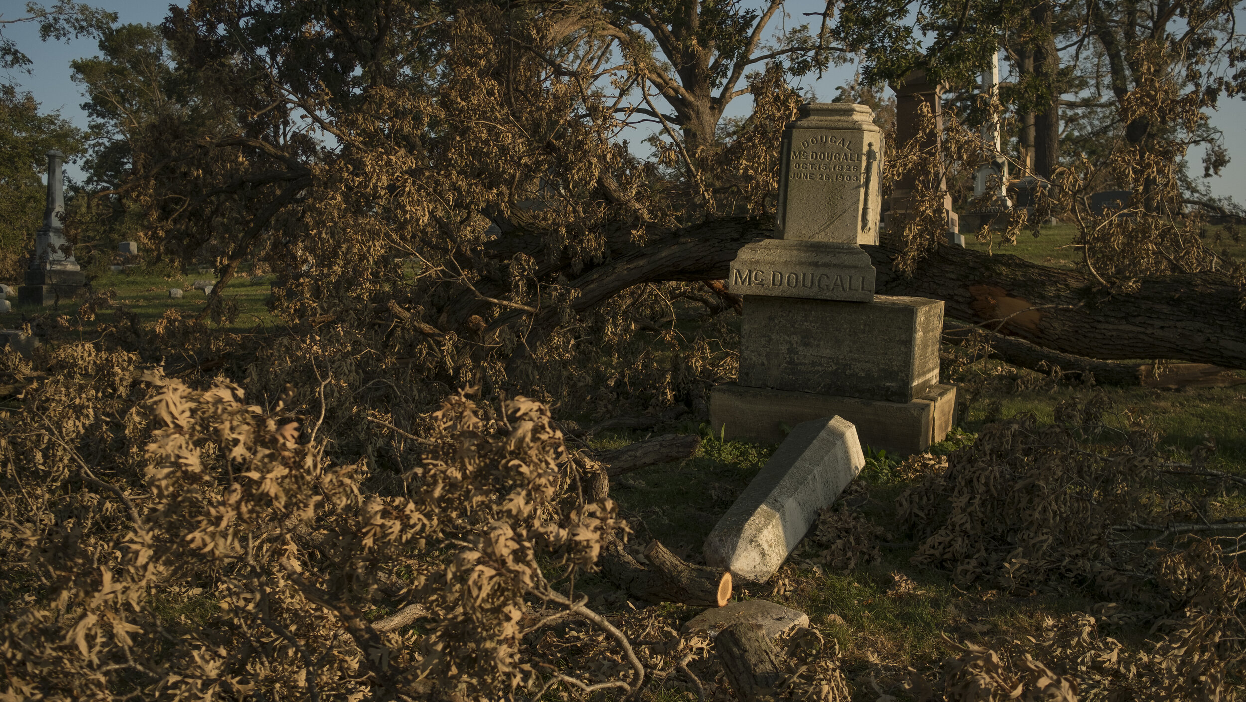  A large piece to a headstone lies on the ground within Oak Hill Cemetery situated next to Mount Vernon Road in Cedar Rapids on Thursday, August 27th, 2020. Decades-old trees that snapped in half unable to bare their own weight, destroyed headstones 