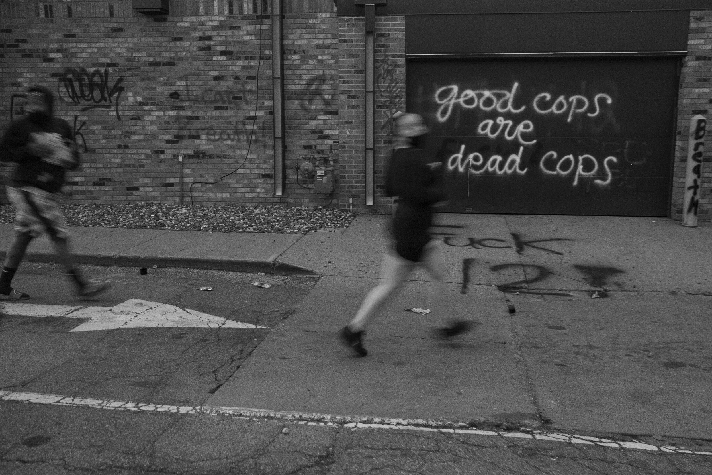  People run away from an Auto Zone as it becomes overtaken during riots in south Minneapolis on Wednesday, May 27th, 2020. For days on end, hundreds of protesters and community members gathered in the streets to condemn the murder of George Floyd by 