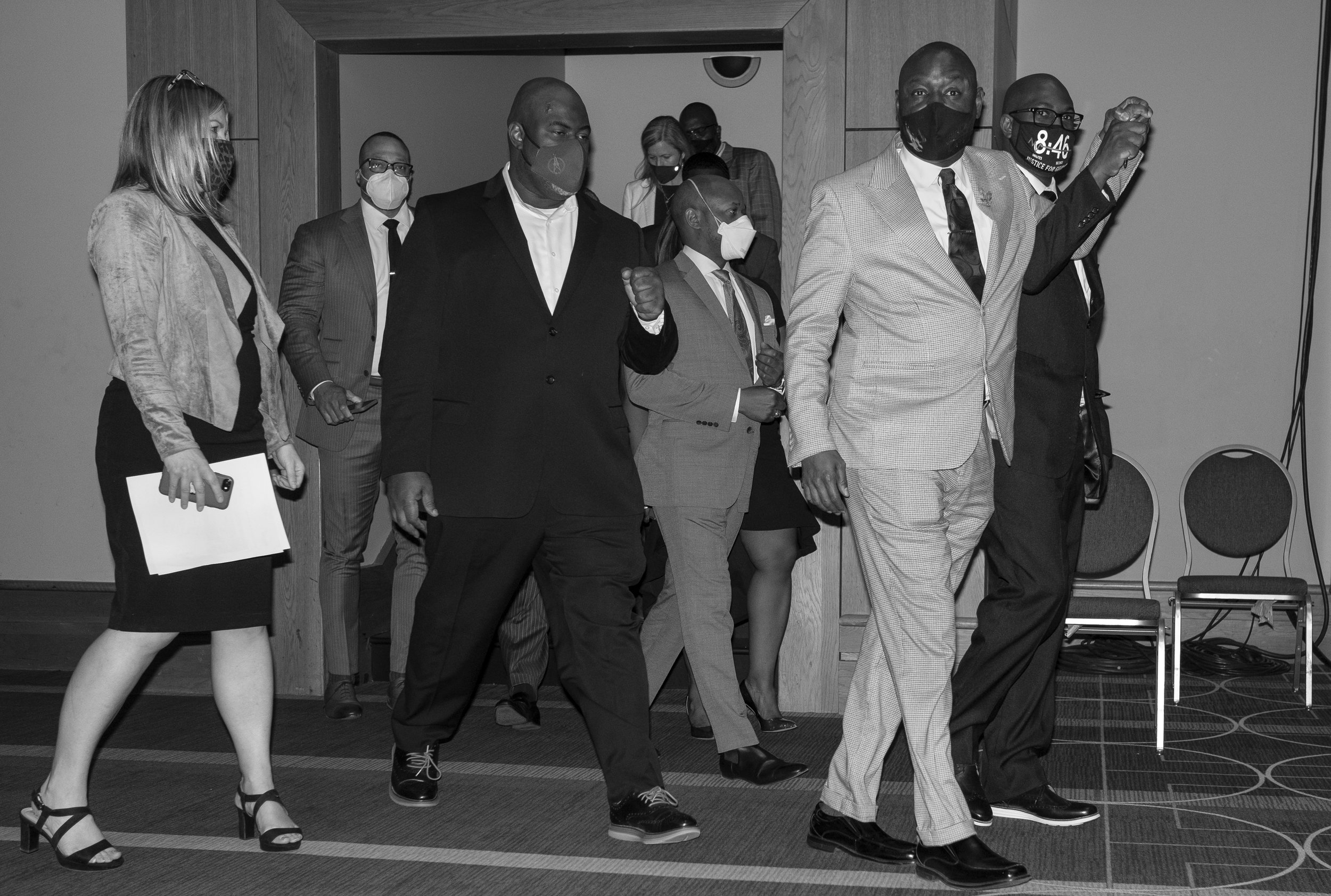  Attorney Benjamin Crump, who is representing George Floyd’s family, walks into the Minneapolis Convention Center with members of the Floyd family and additional members of their legal team. Today George Floyd’s family, their legal team, the city of 