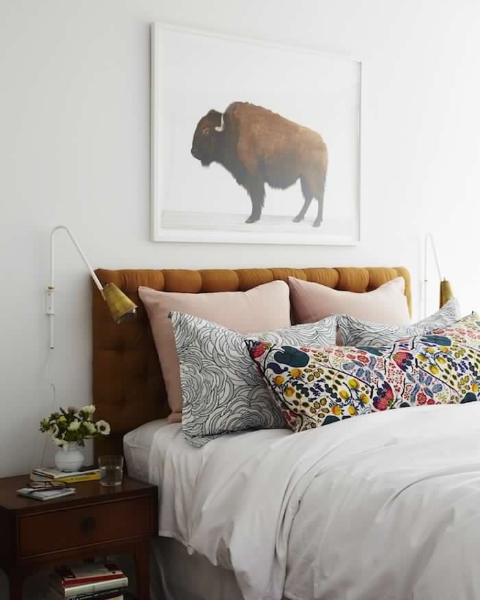 The combination of mustard yellow with blush pink in this bedroom feels cozy yet fresh and ready for spring. 
