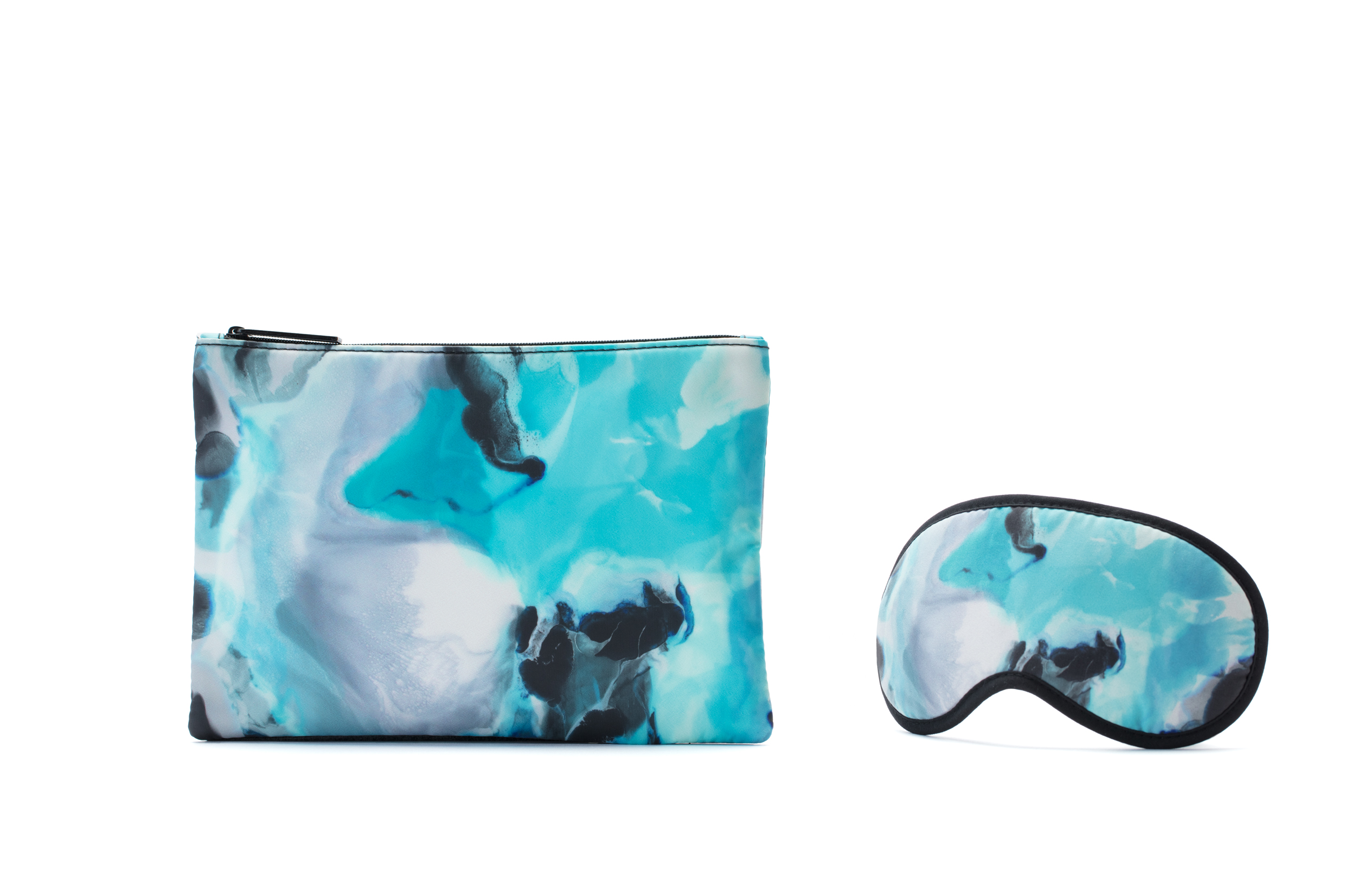 A matching set of a eye mask and a zippered pouch with a blue, white, and black marble pattern.