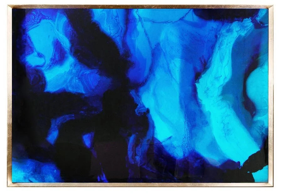 Abstract blue and black flowing ink or paint on canvas.