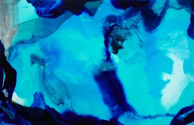 Abstract blue ocean-like painting with dark and light blue swirls and patches.