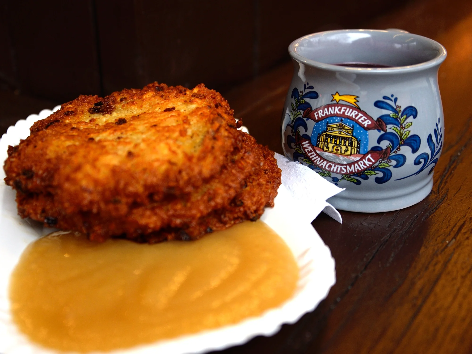 Potato cakes with apple sauce and a cup of Feuerzangenbowle