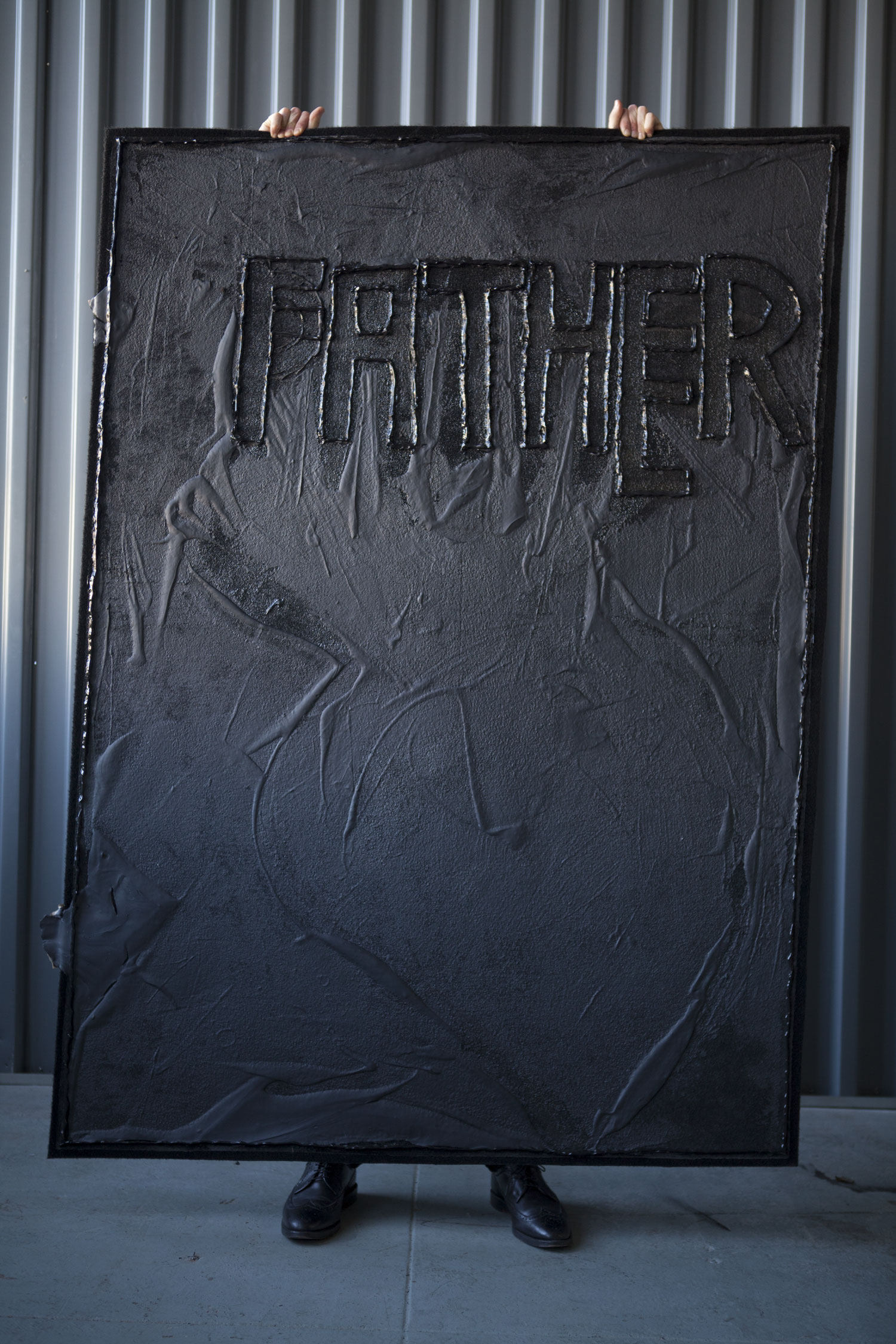 Father, 2013 *Carried by Raphael Sigal American coal tar and black silicon on black carpet MANA studio, NJ Photographer: Amina Hasen 