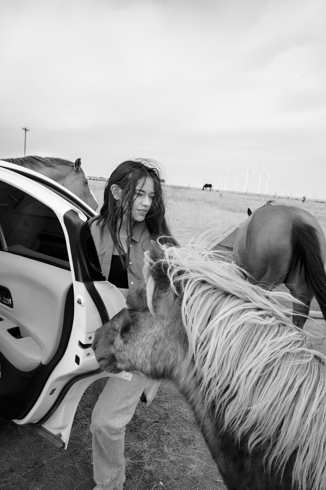 Andrea with horses and car in Texas for Everlane.jpg