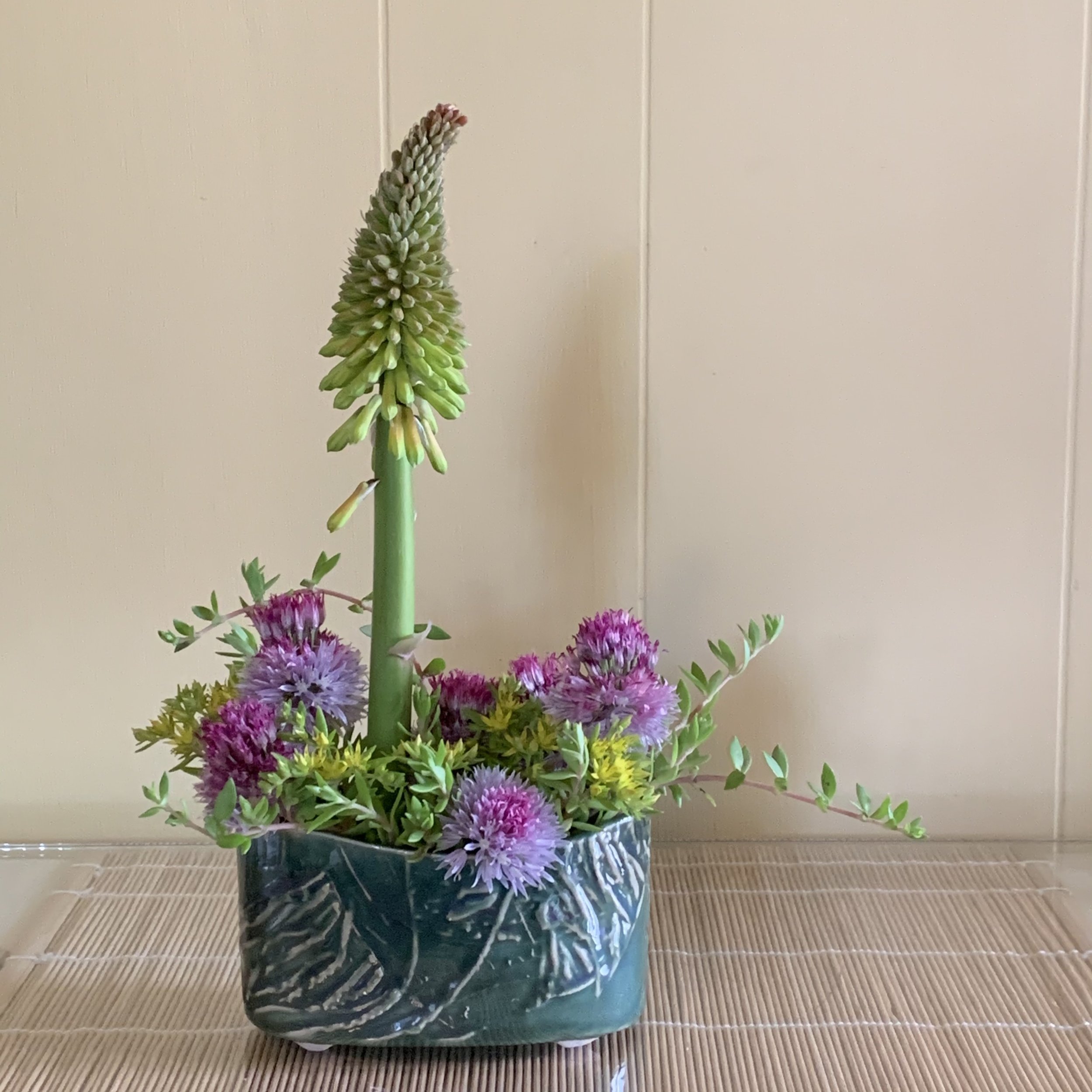 The unique shapes and textures of the pottery vases inspire plant material choices and the attached pin frogs make it easy to keep the flowers and greenery in position during and after designing.