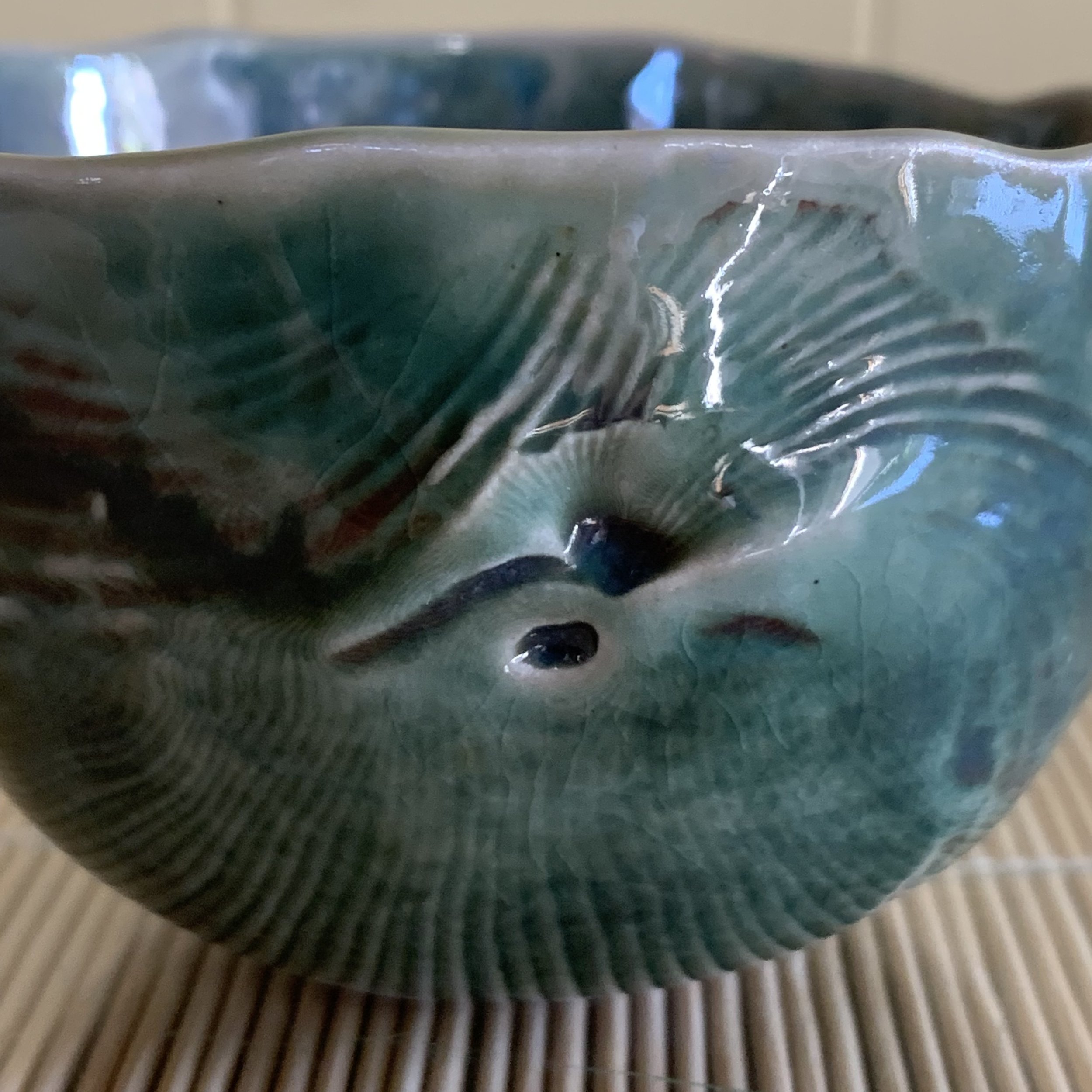 Susan’s favorite clay is stoneware fired to cone 10 in a gas fired kiln, however, she also uses a midrange stoneware, and earthenware (for some of the Island vases). Glazes have been formulated or chosen to enhance the textures created in the formin