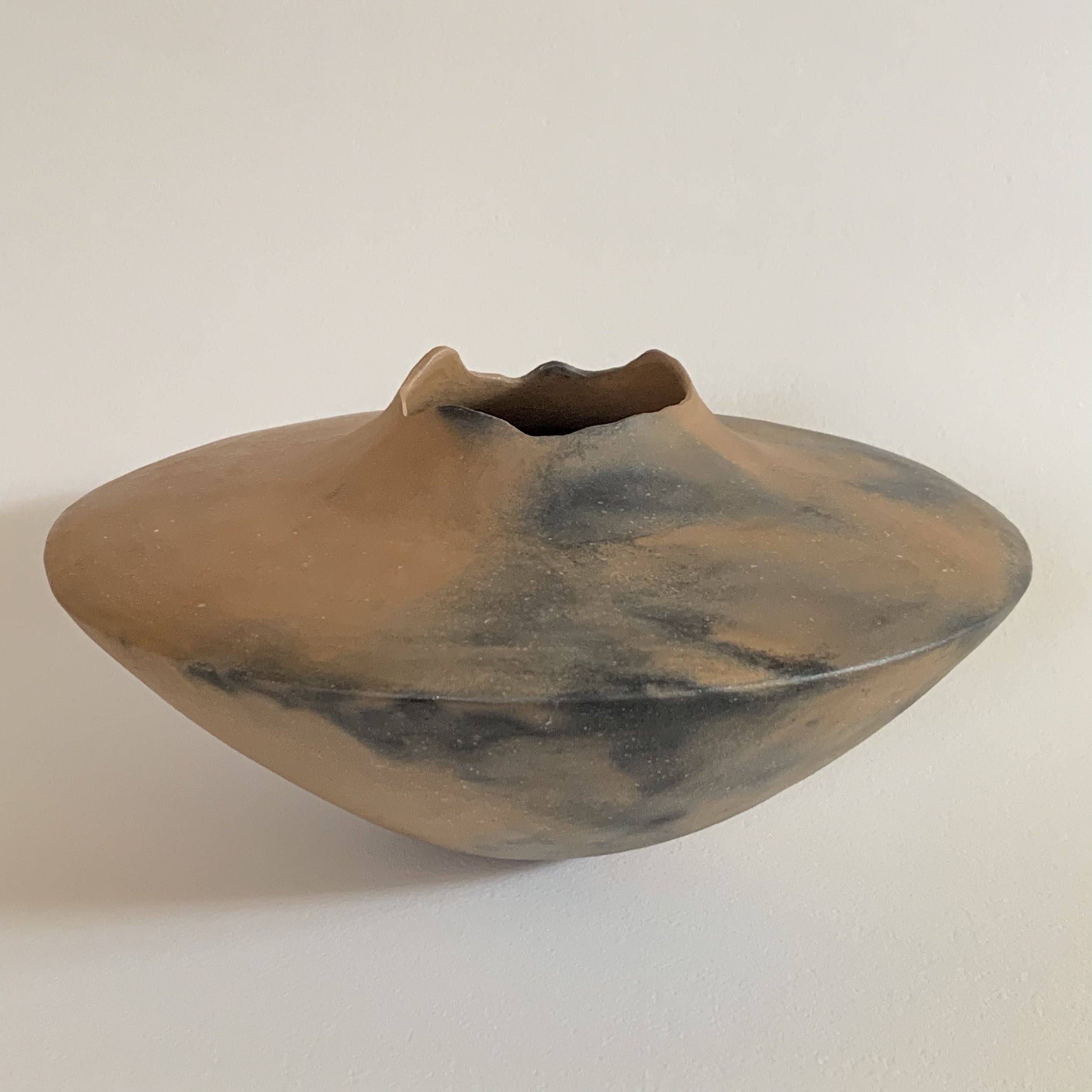 Interest in using real fire (Susan is a longtime campfire fan!), prompted her to experiment with both Raku and “pit firing” (using a perforated popcorn can).