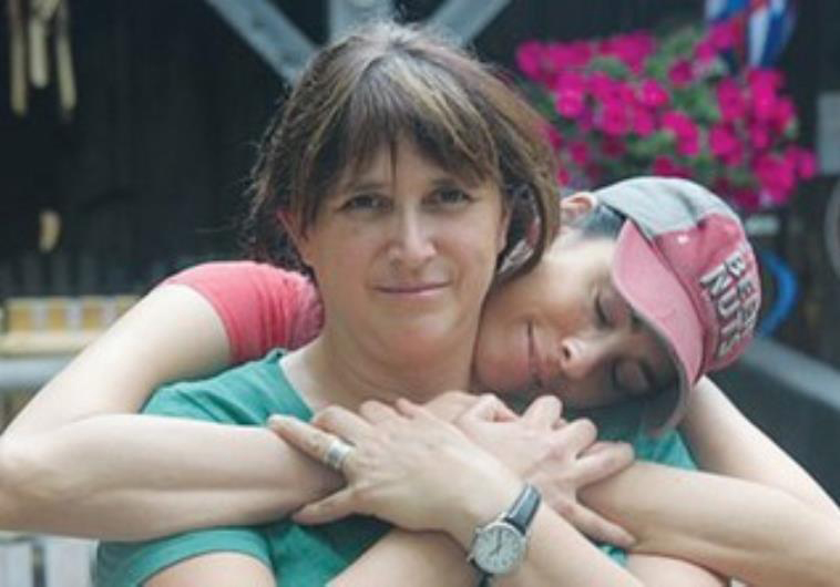 Comedian Sarah Silverman embraces her sister, Rabbi Susan Silverman.