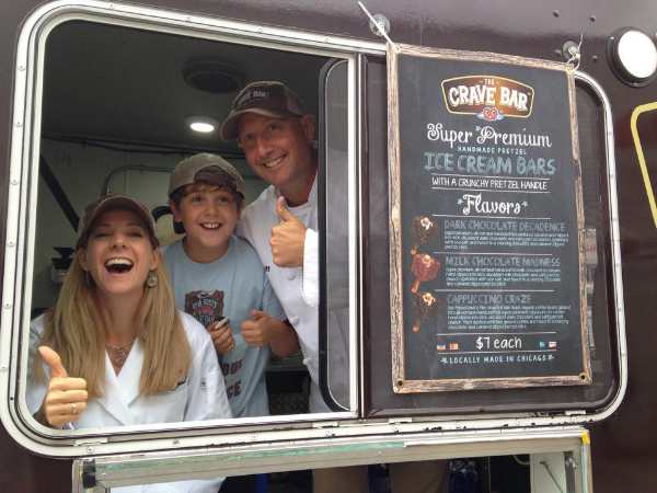 Kim and Scott Holstein in their Crave Bar food truck. Photo courtesy of The Crave Bar.