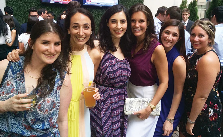 Young Women's Leadership Network members enjoy a happy hour networking event in July 2016.