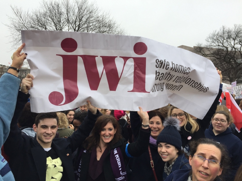 Photo by Lauren Landau Left to right: Jules Jacobs, JWI VP of Communications Meredith Jacobs, JWI CEO Lori Weinstein, Emma Bethel, Chloe Bethel, Dr. Robyn Jacobs, and Erica Basta at the Women's March on Washington, January 21, 2017.