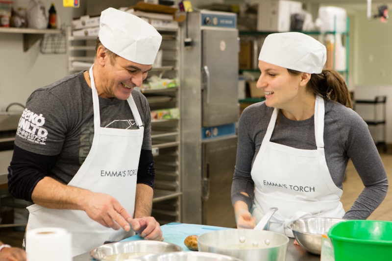 Emma's Torch Founder and CEO Kerry Brodie teaches a student how to cook during the nonprofit's pilot program in December 2016.