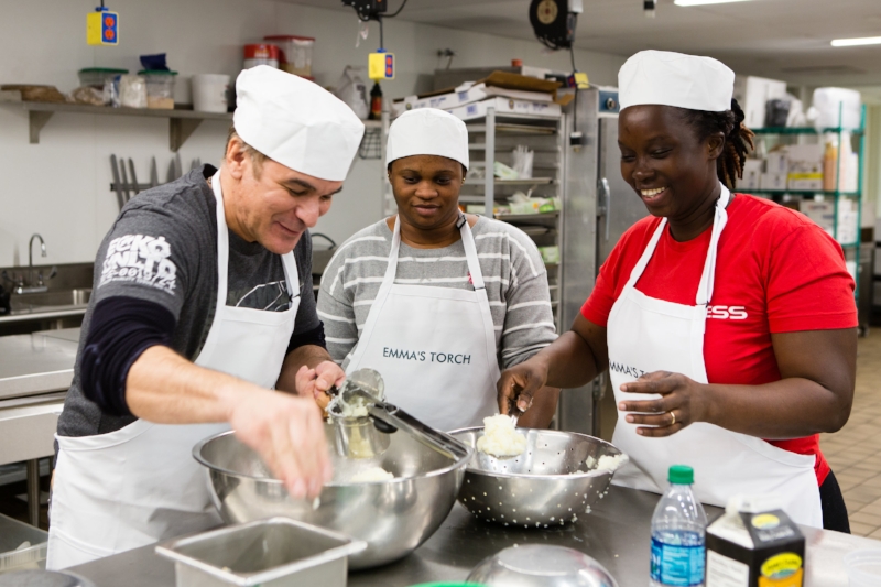 Three Emma's Torch students have fun in the kitchen. 