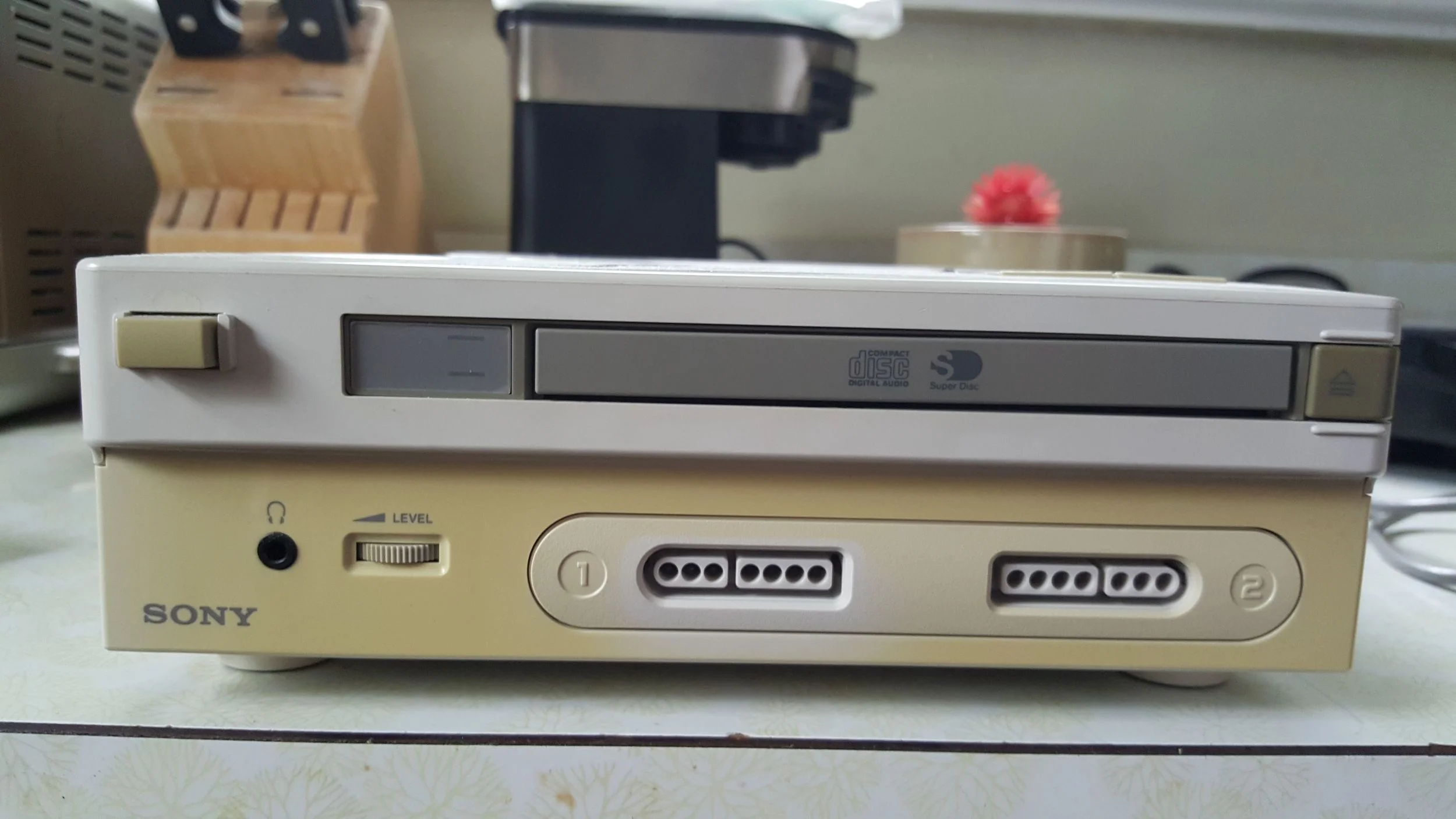 I guess this is what a Sony PlayStation would look like if you sandwiched it on top of a Nintendo SNES.