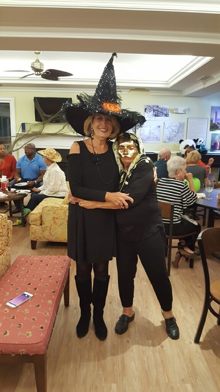 Miriam the tallest witch gives the golden girl a hug.