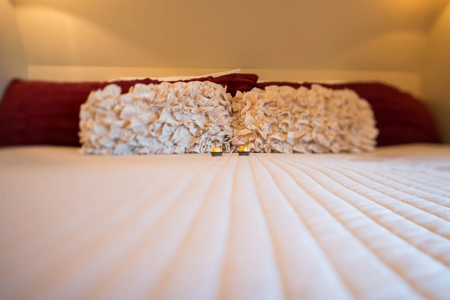 close up of pillows on a bed
