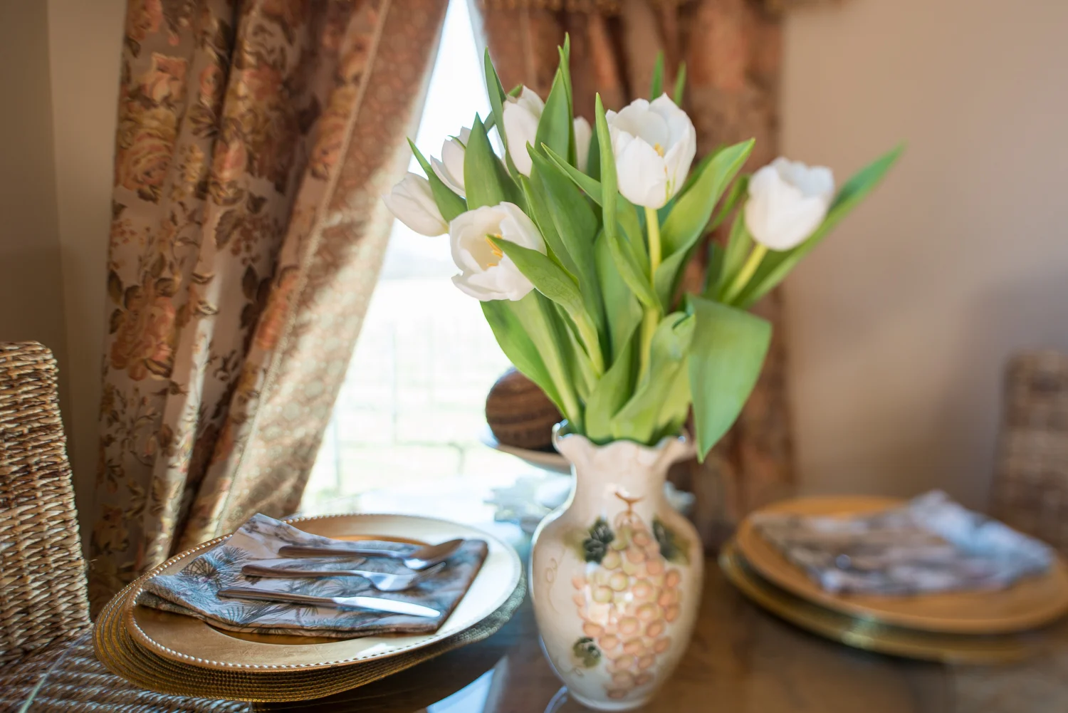 flowers and plates on a table