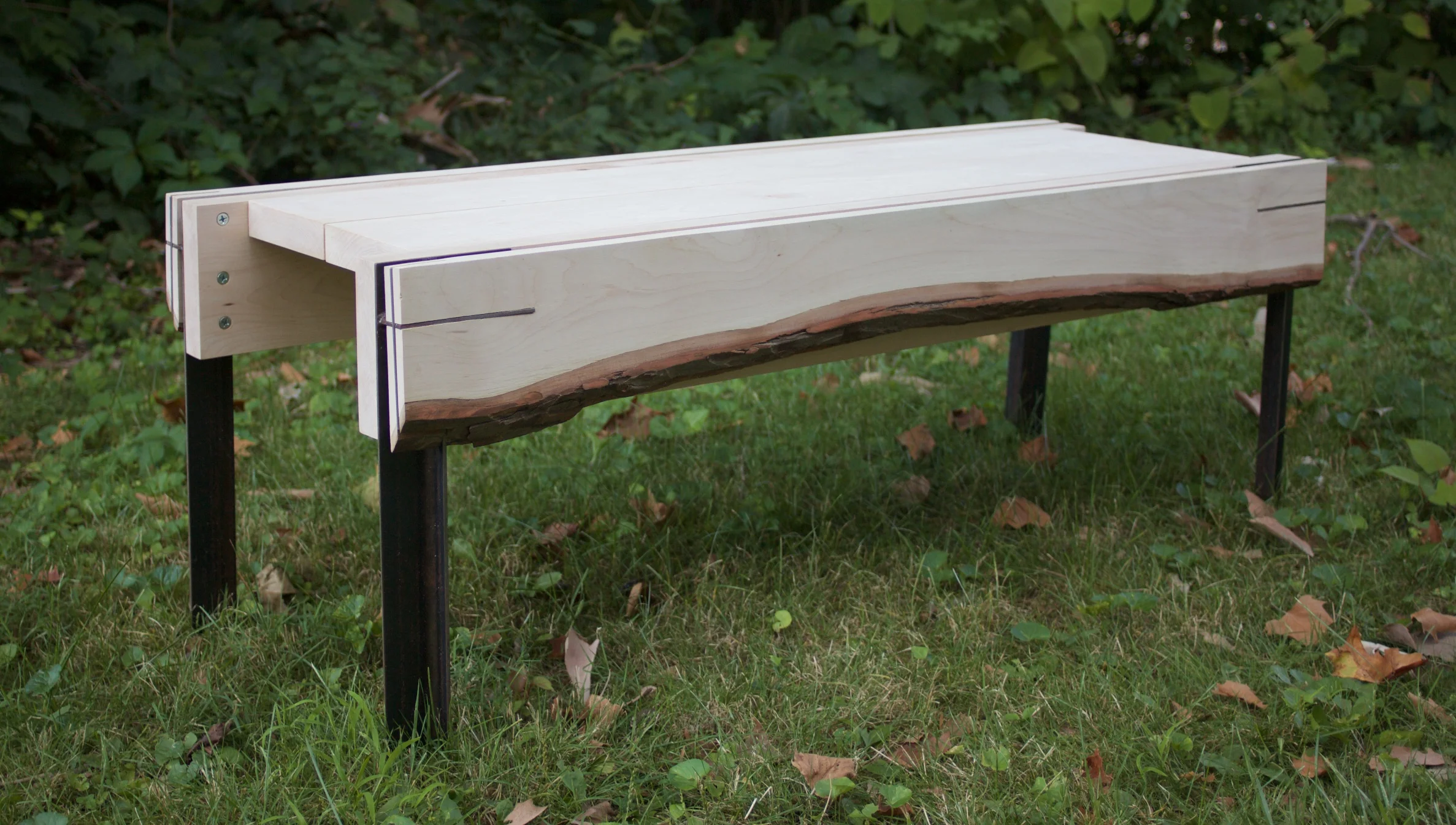  I experimented with hidden interlocking metal joinery to attach the live edge face, the bench was designed to be fully disassemblable for transportation. 