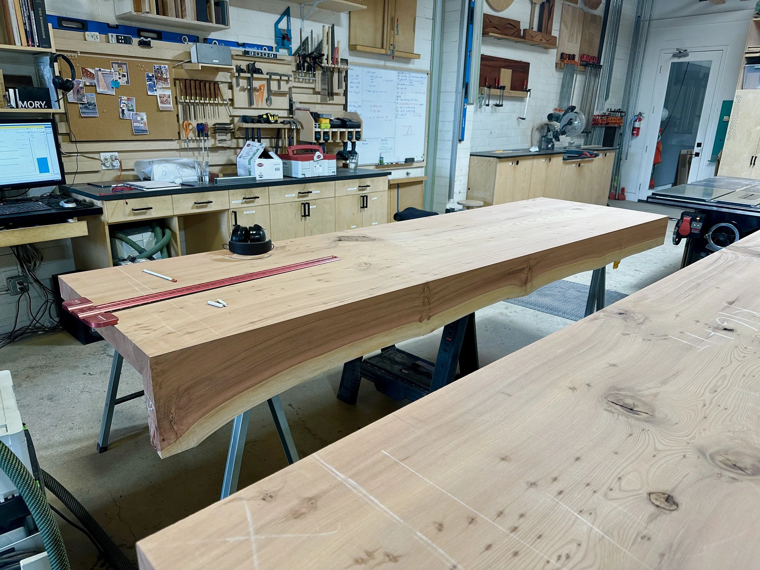  Waterfall Redwood Bench  2025  A set of two custom redwood slab benches for a lobby of an affordable housing project located in East Palo Alto. Each slab is 3” inches thick and 9 feet long with a mitered live edge detail. 