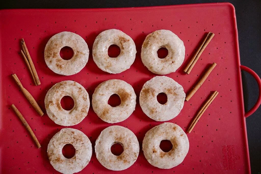  We are well into the fall season and aside from every type of food and drink item that has pumpkin in it, I am also moving well into my apple cider and apple dessert obsession. With all that being said, I have created these Apple Cider Cinnamon donu