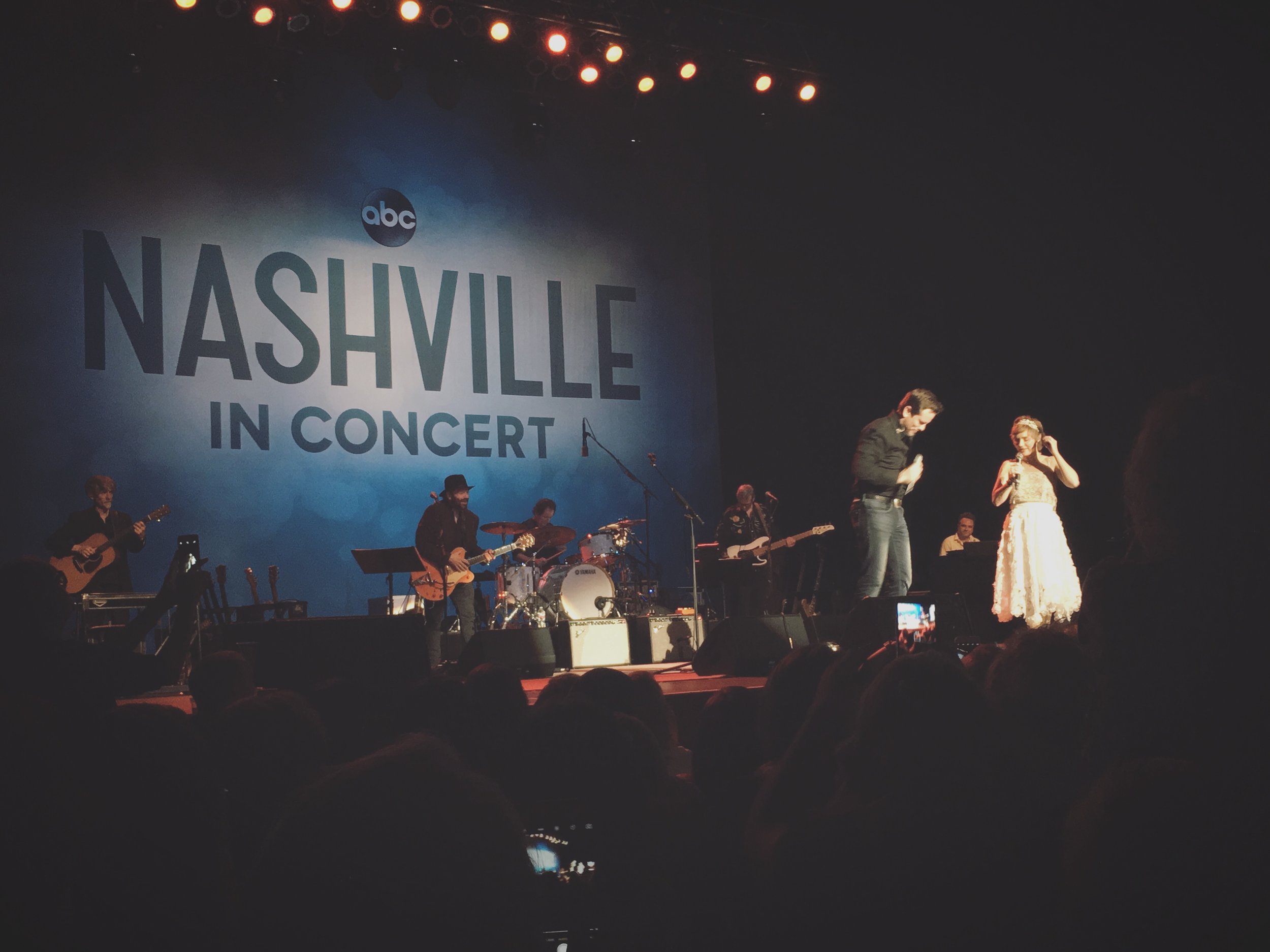 Charles Esten (who plays Deacon Claybourne) and Clare Bowen (who plays Scarlett O'Connor) sing and dance on stage during a duet. (Photo credit: Reagan Fleming)