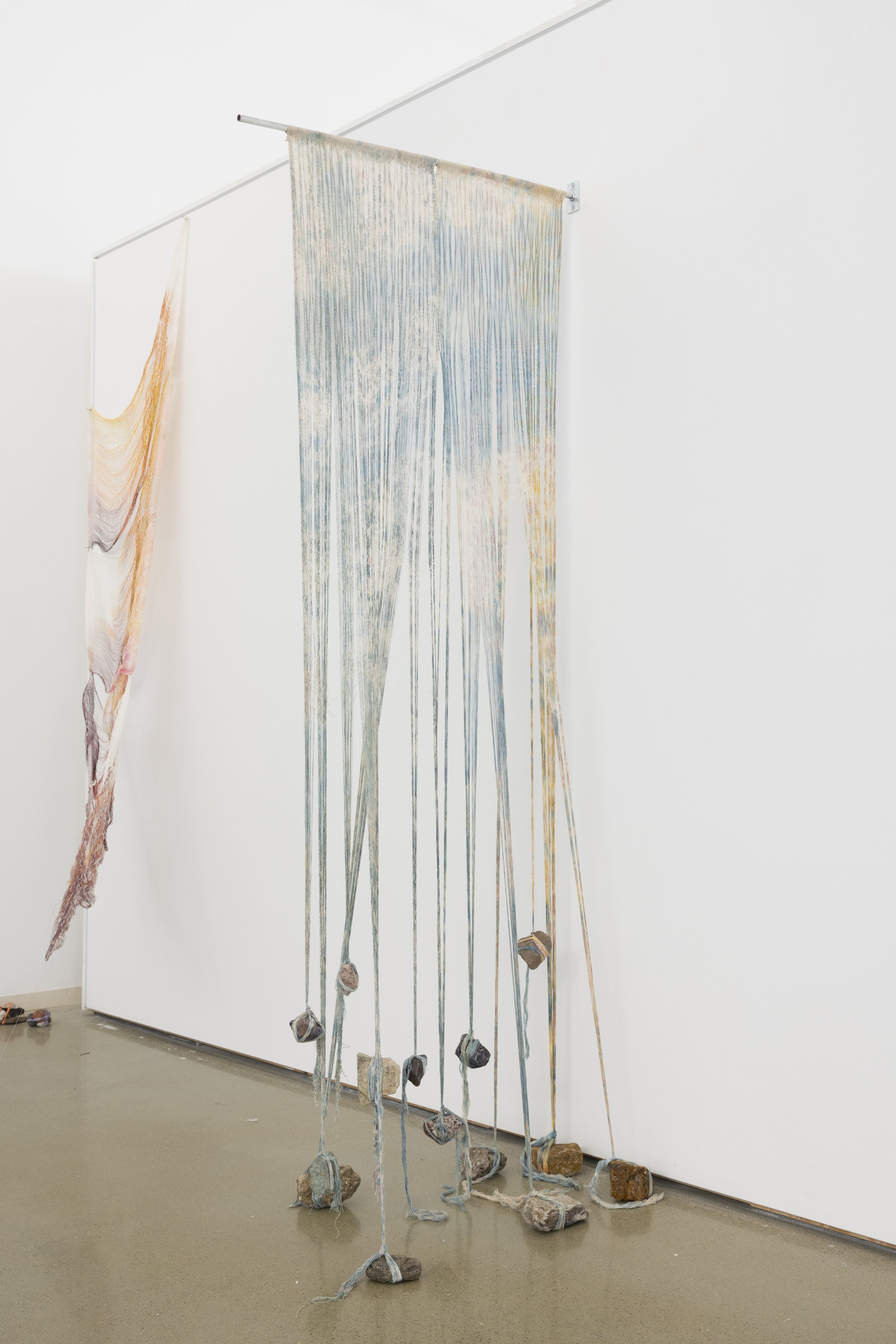   warp/weight   screen print, cotton, nylon, stones  dimensions variable  2023 