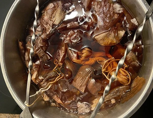 Embroidery thread in onion skins dye bath
