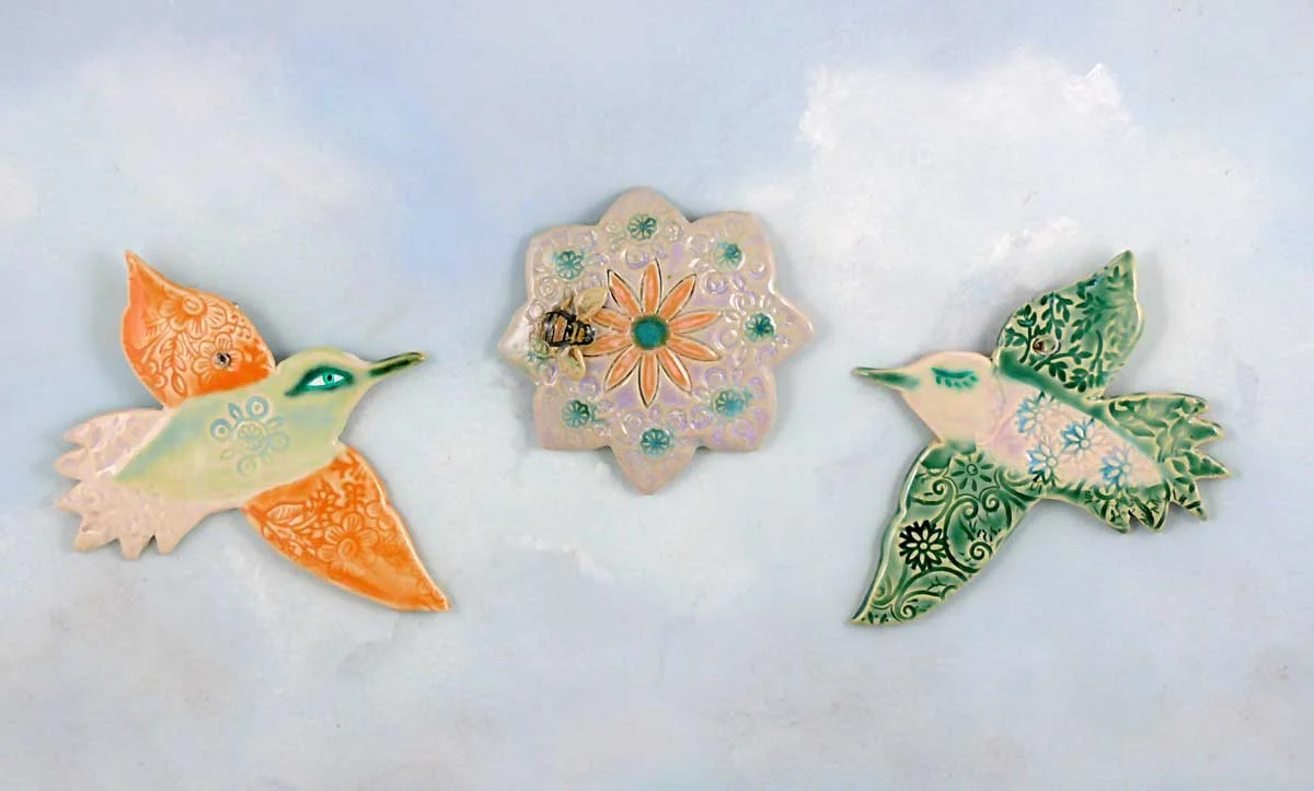 Porcelain hummingbirds and flower medallion. Cathy Kiffney Studio