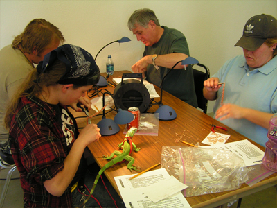 Students participate in Rob Glover's jewelry workshop
