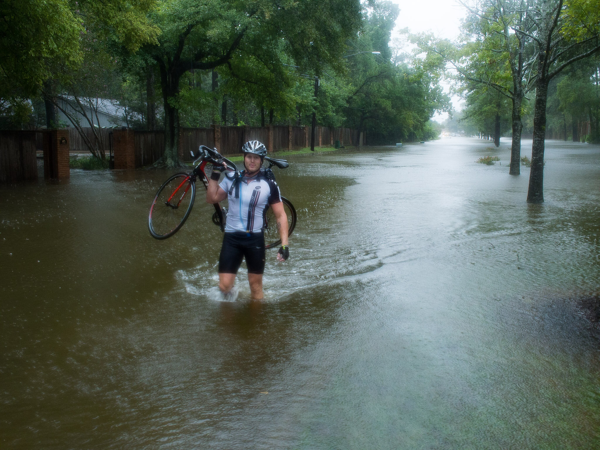 Cyclist Navigating Flood Waters