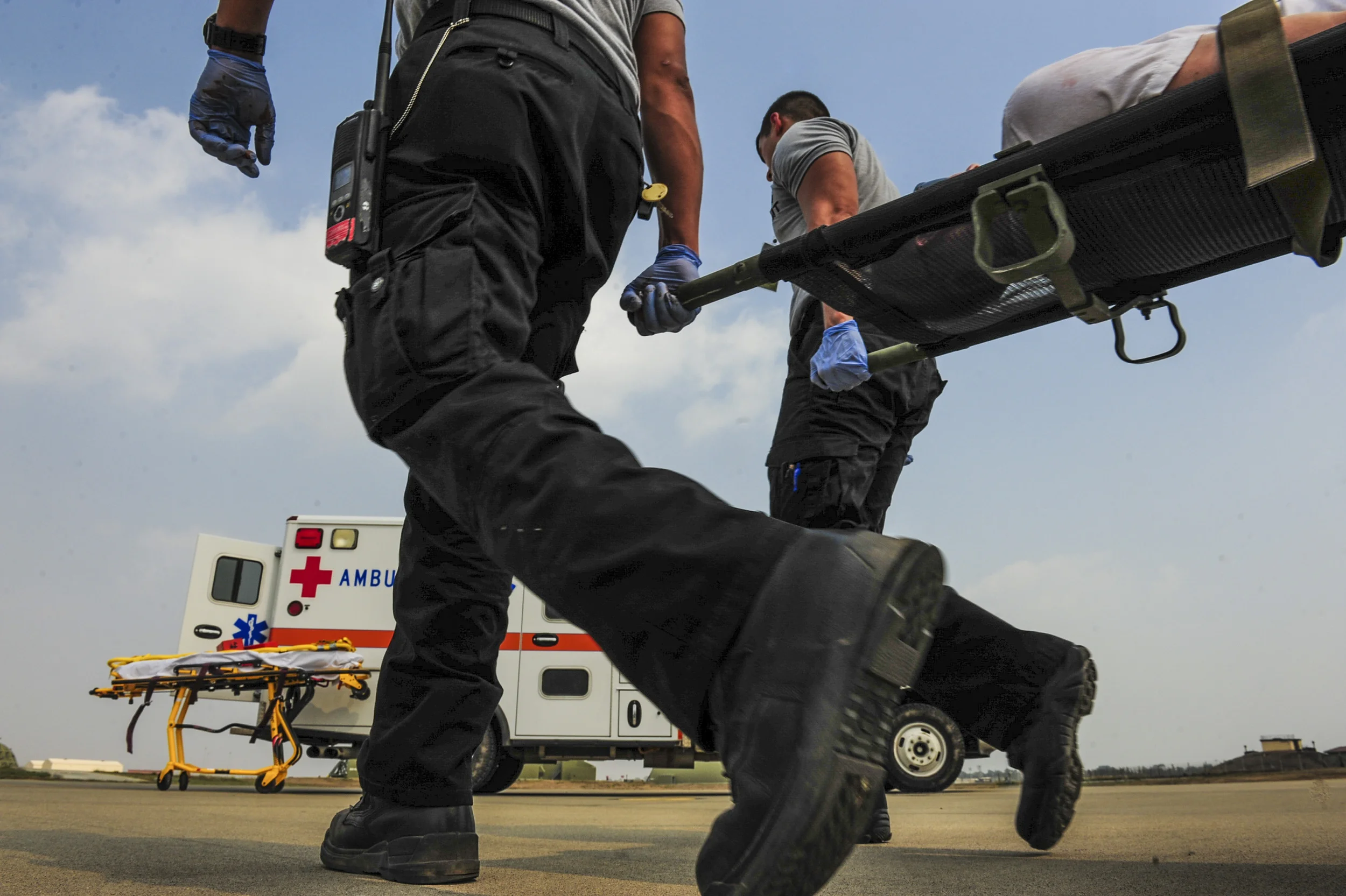 First responders from the 39th Medical Group carry a patient onto an ambulance during a local readiness exercise Aug. 28, 2014, Incirlik Air Base, Turkey. First responders from the 39th Air Base Wing attend readiness training which keeps skills shar…