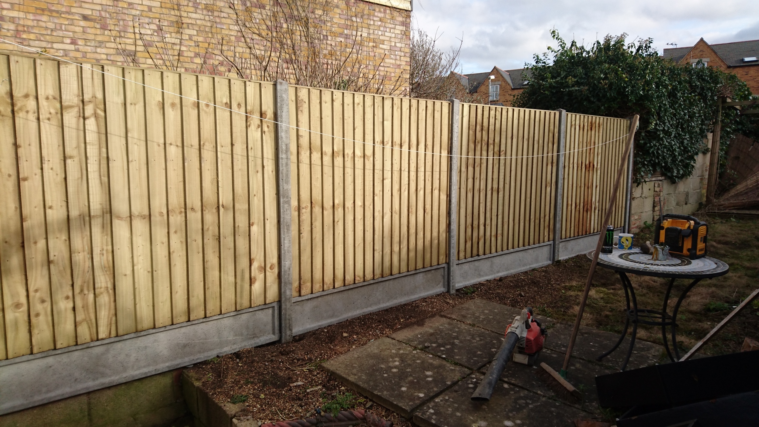 Closeboard panels on concrete gravel boards and posts, Oxford