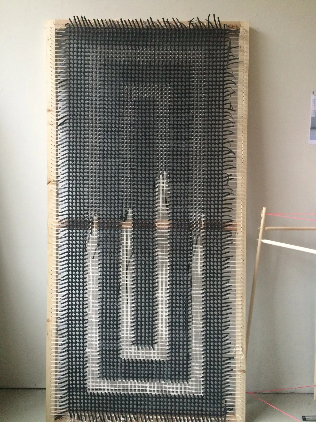 This knotting technique works like pixels and therefore any shape can be accomplished. I chose an orthogonal design to help make the tedious weaving process more efficient.