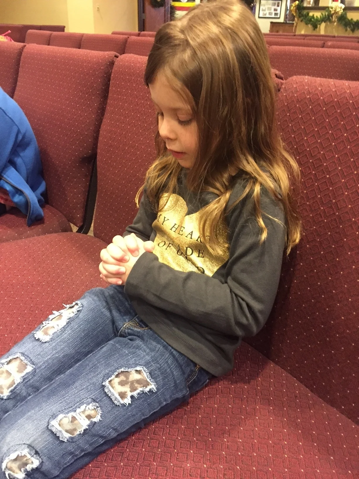 Children in the school learn how to pray in chapel and throughout the day.