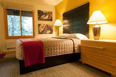 Tamarack Hall (20 total spots available): Designed to be a space for artists to have both private and communal space, Tamarack Hall features hotel-like accommodations with shared but private bathrooms, and shared kitchenette, laundry facilities, and a central meeting room with a large fire place. There are 20 private bedrooms, each with one queen-sized bed. Retreat price including private Tamarack Hall lodging is $2100
