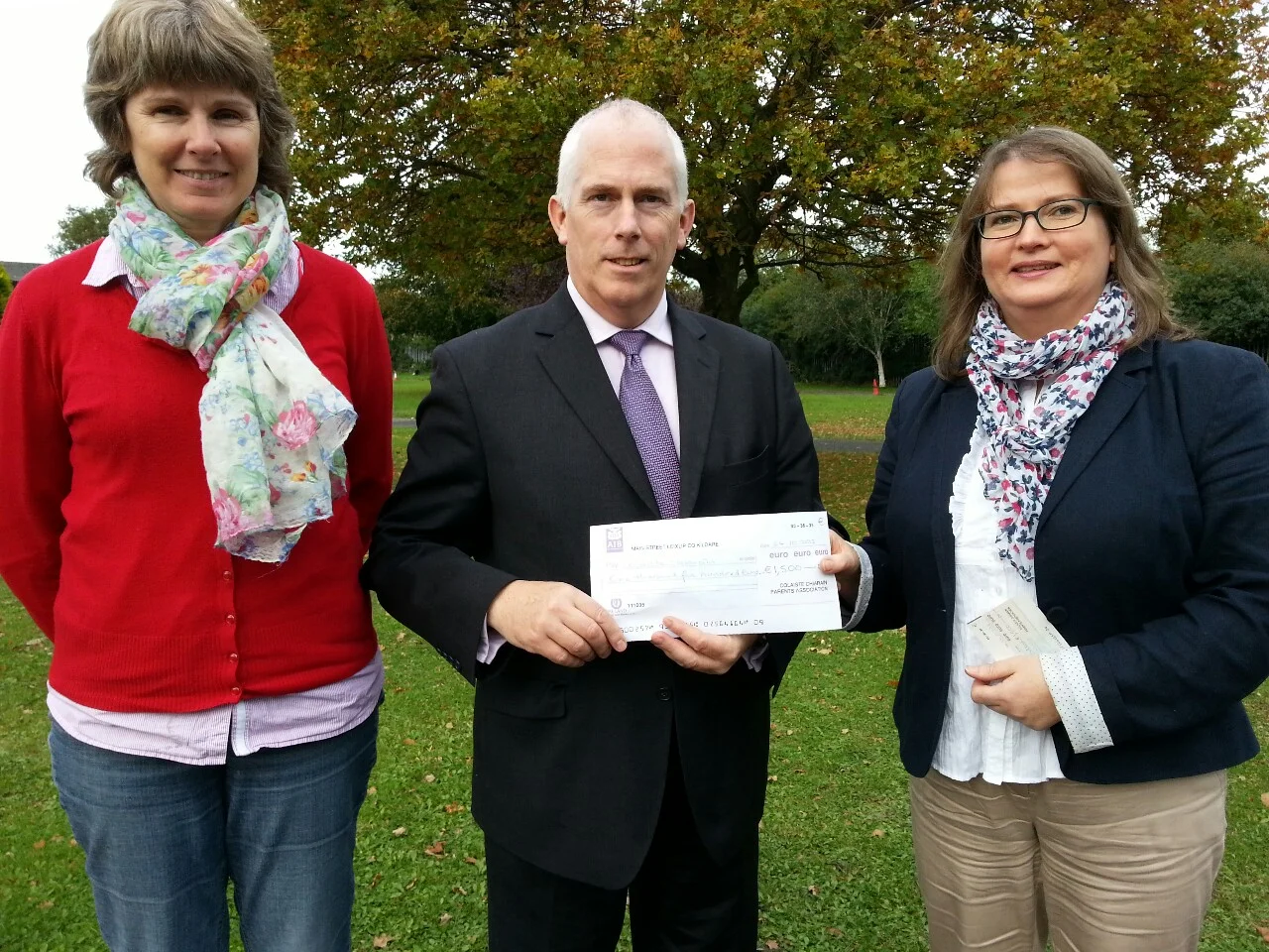 Parents Council members Anne Timmins and Claire O'Mahony presenting a cheque for €1500 for the development of the school library to the Principal Joe Sweeney. The money was raised through a number of fund raising initiatives organised by the Parents Council.