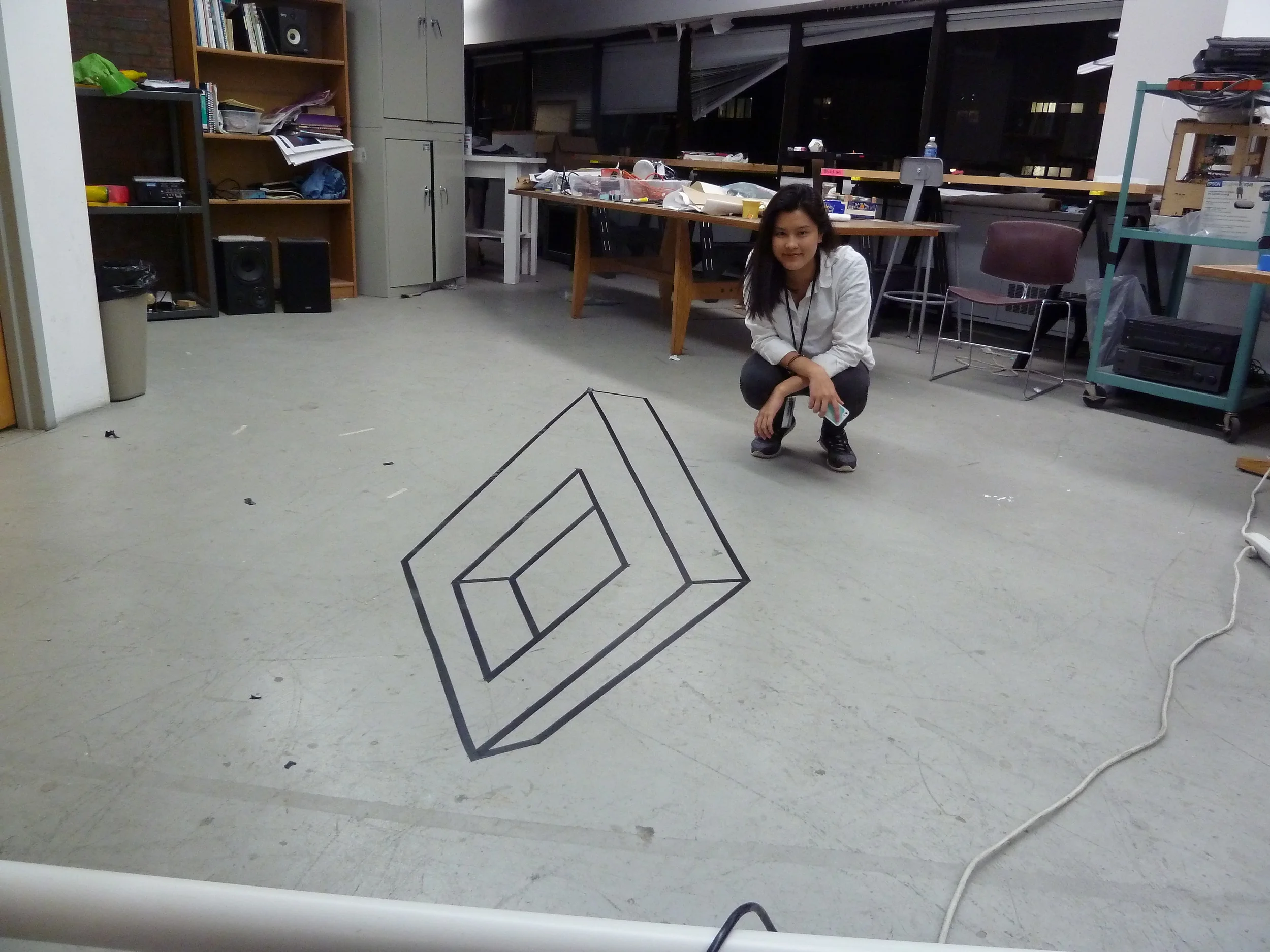  I colloborated with Pat Davivongsa to create a couple quick anamorphic drawings in the DMI workspace. We used the much simpler and effective technique of using a projector to create this one. 