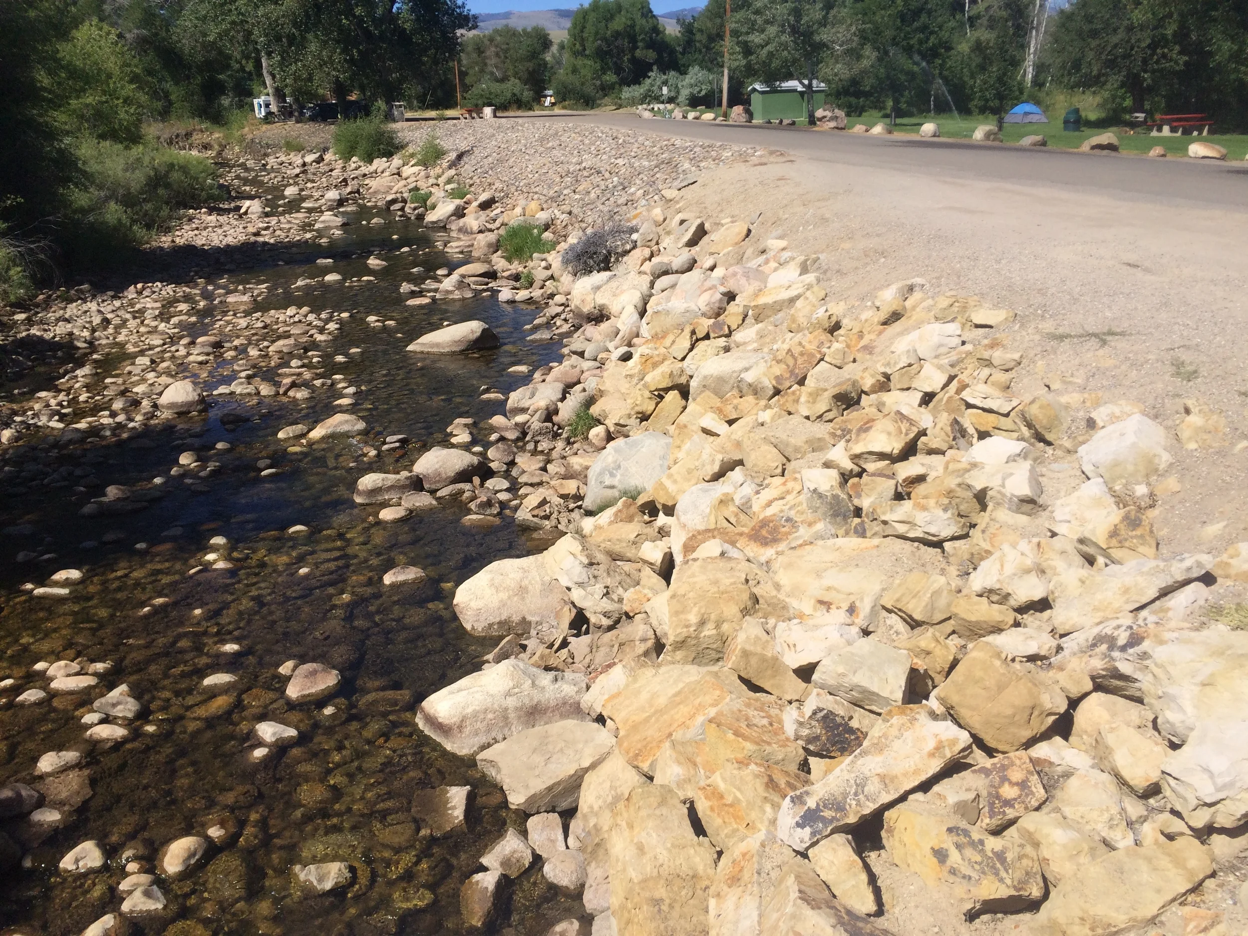 2015 - Post-flood. Rip-rapped banks and a channel with little definition or habitat