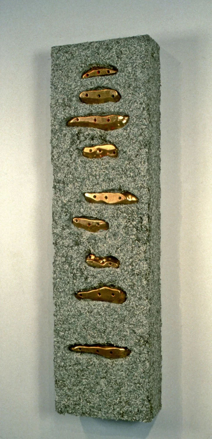    Extreme VI, 2001 ,   18”x36”x 6”, shredded currency, plated climbing grips  