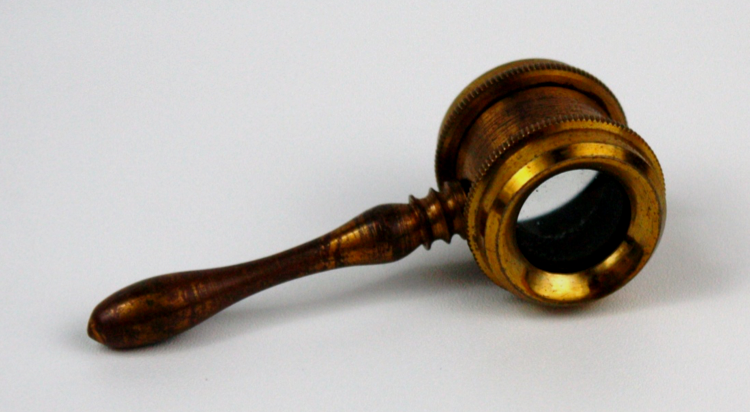 Coddington Lens in brass frame.png