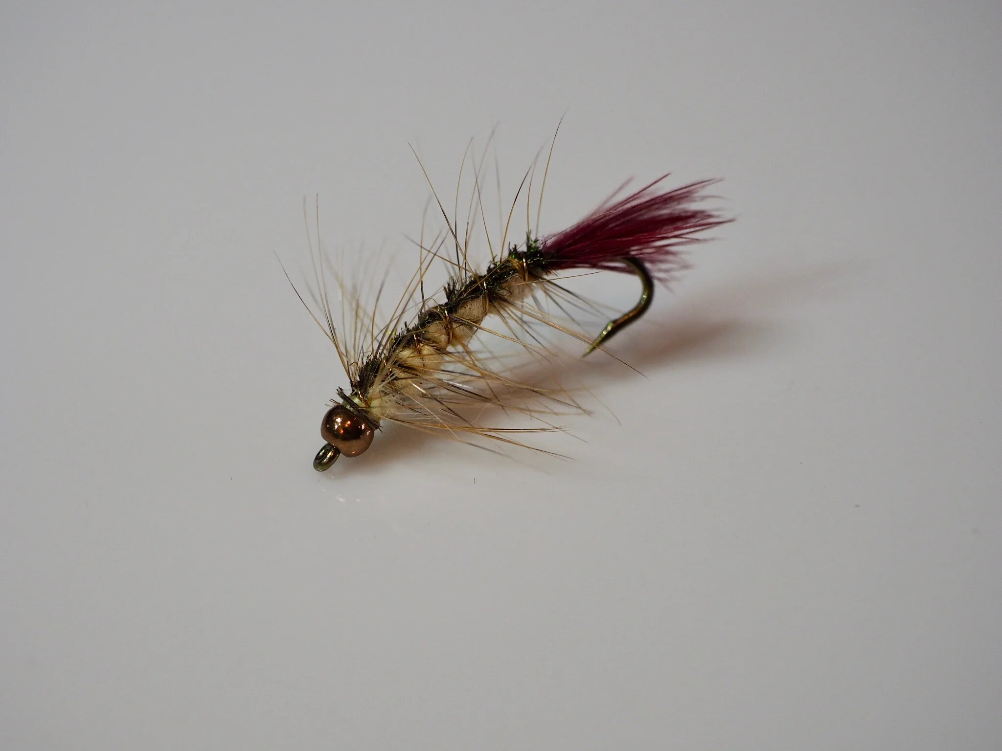 Add a tungsten, brass or glass bead to fish the fly deeper