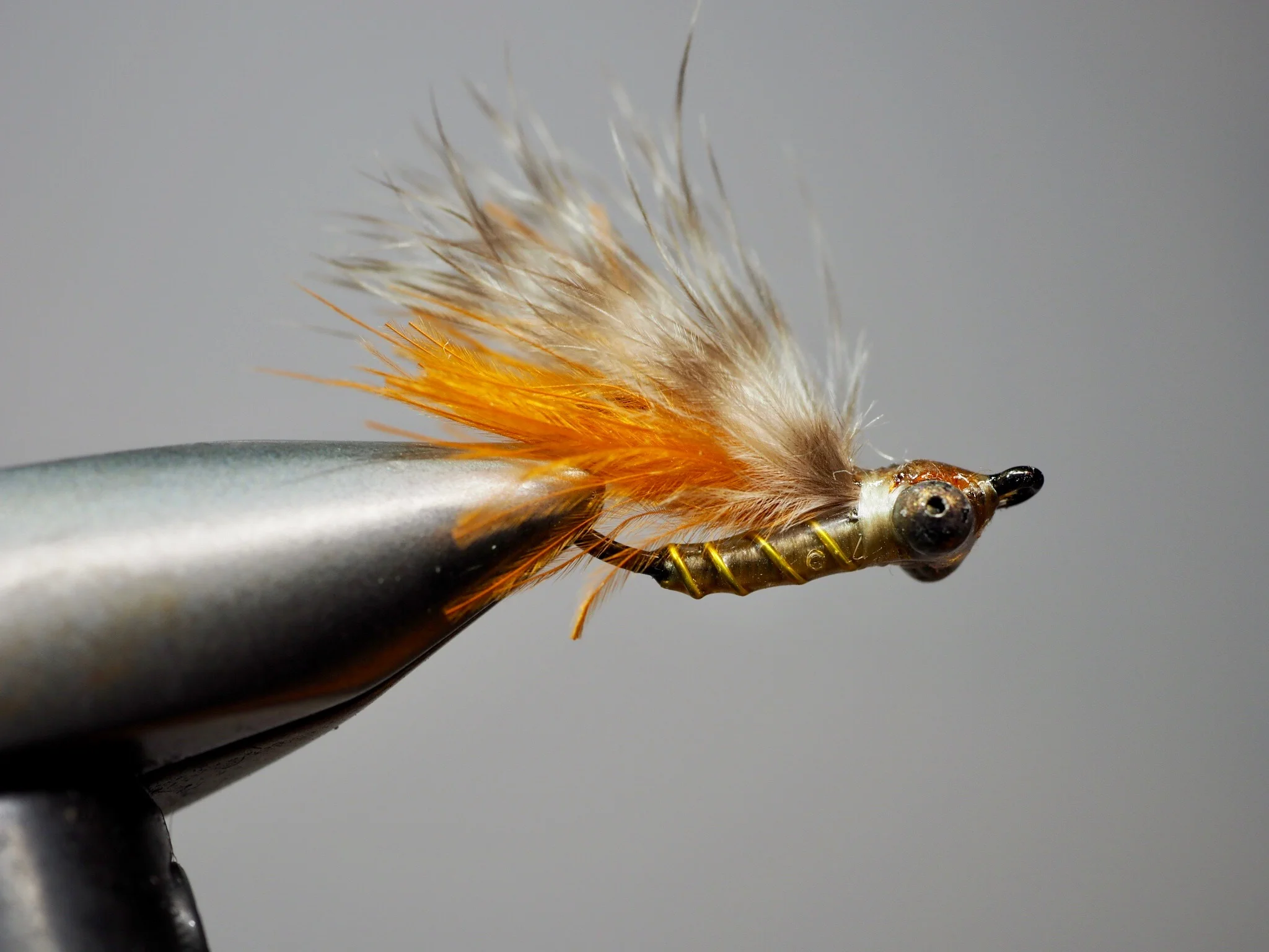 My favorite SMP is tied with a barred marabou wing. UV resin makes this pattern bombproof, it will hold up to dozens of fish. Tied on a Gamakatsu hook designed for bonefish (SL45), it will hold any bass that decides this panfish pattern was meant for him.