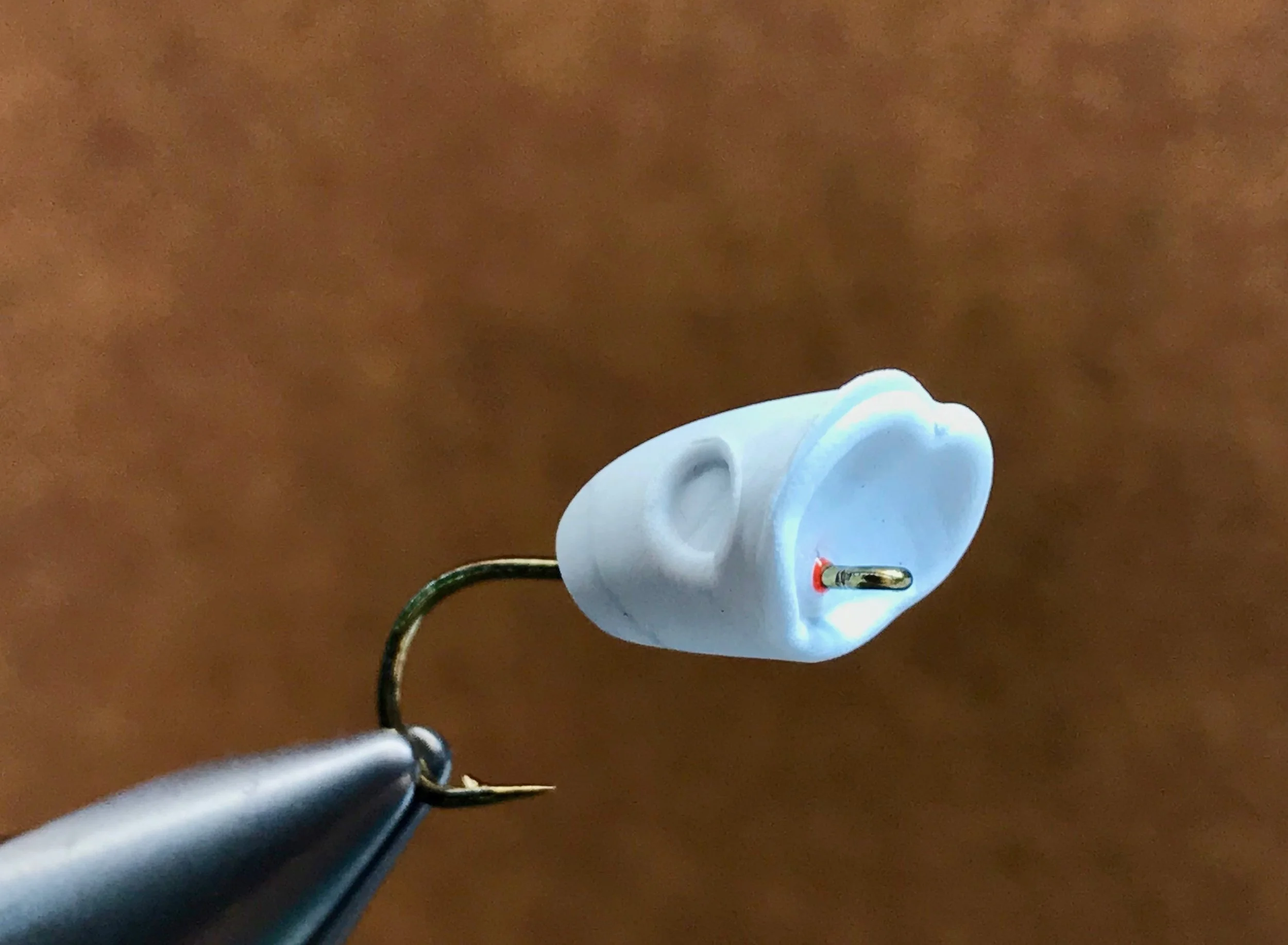 Remember not to push the body too far forward! It will make it difficult to tie the popper to the end of your leader.
