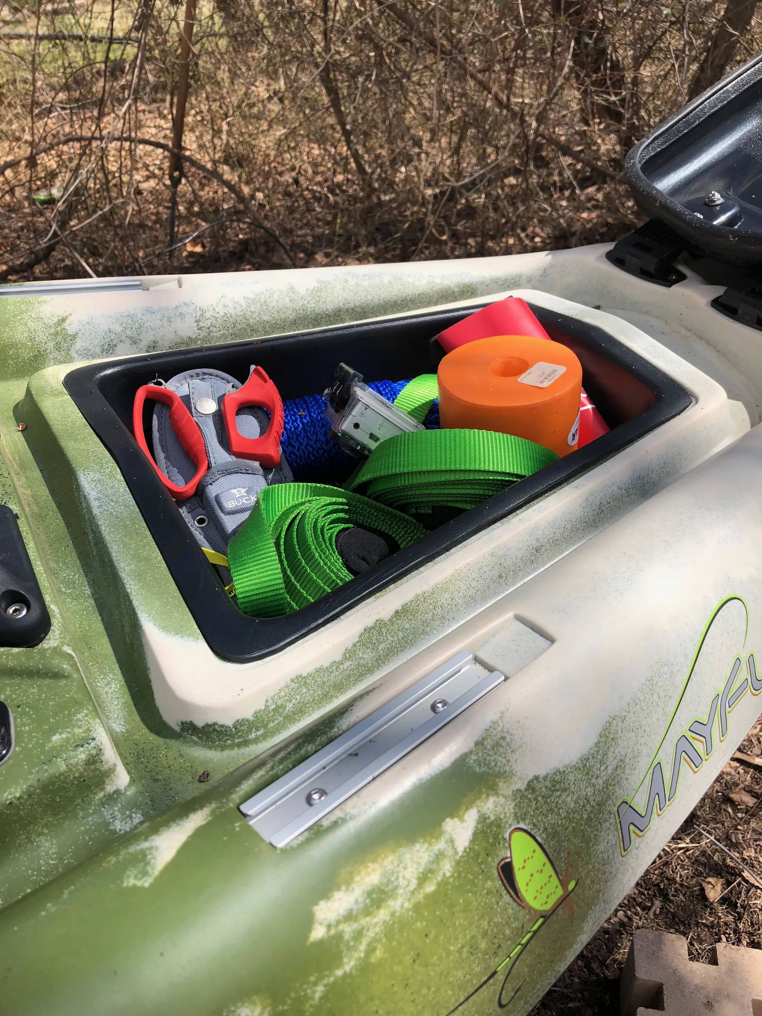 The front hatch open with the insert in place. The insert keeps small items from getting lost down deep in the hull of the boat.
