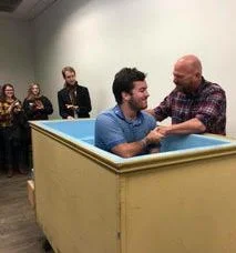 Asher getting baptized
