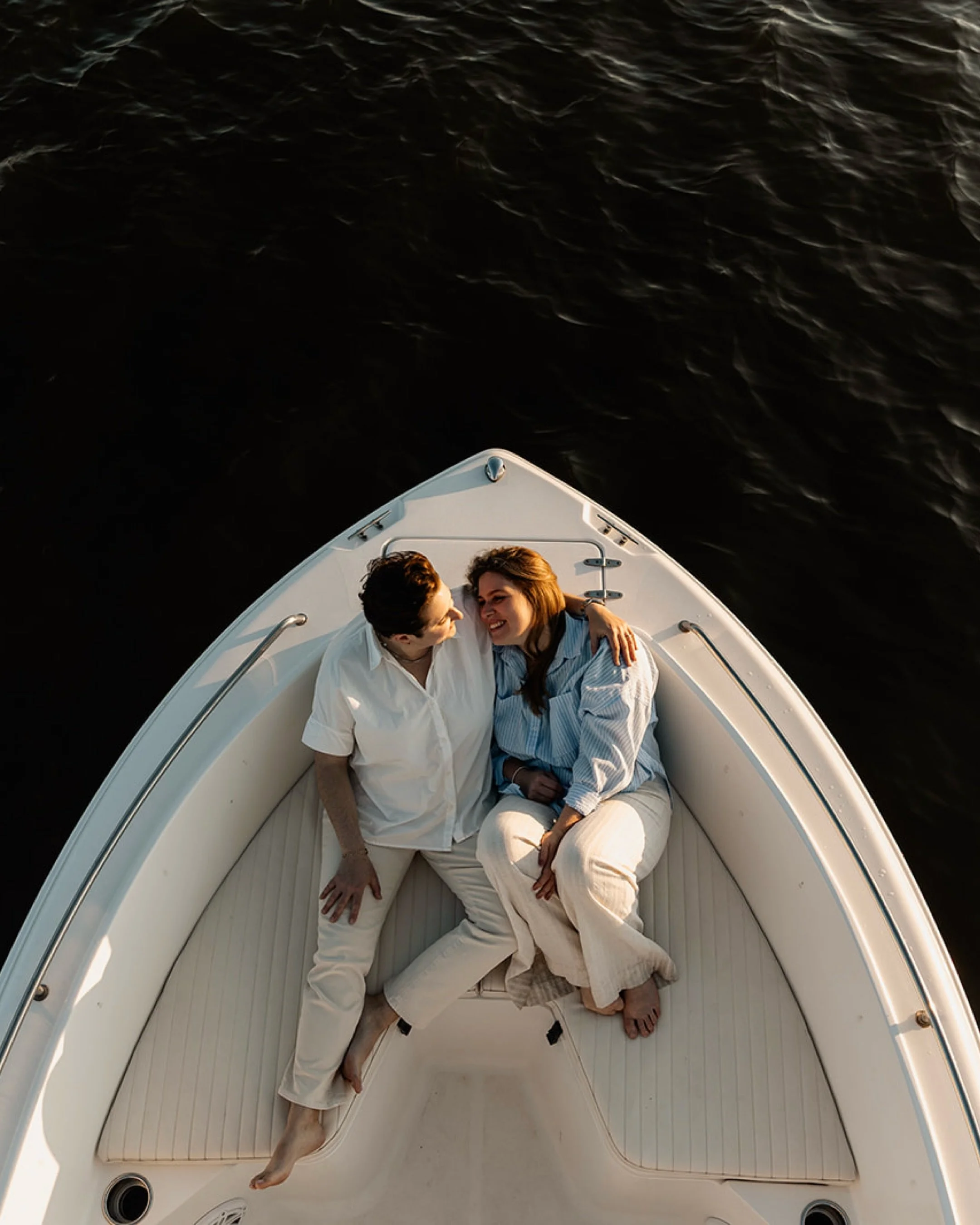 Some love stories are written on land. Theirs is being written on the water. ⚓️
These two traded the usual engagement backdrop for their boat,  because that&rsquo;s where they&rsquo;re most themselves: sun on their faces, wind doing whatever it wants